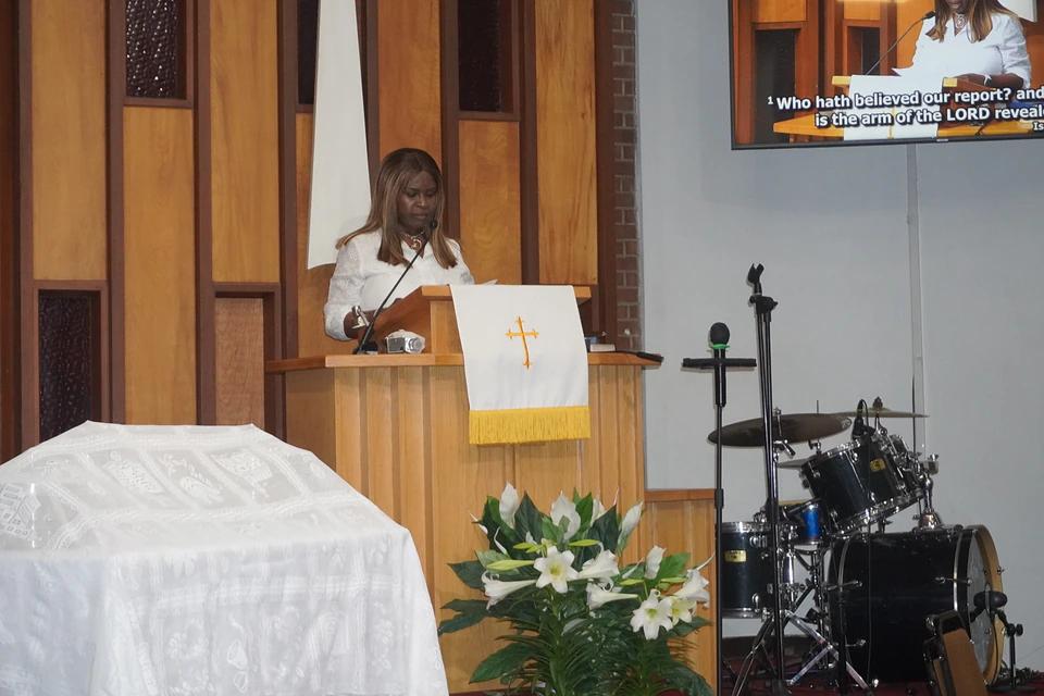 A reader sharing Scripture at the Easter pulpit