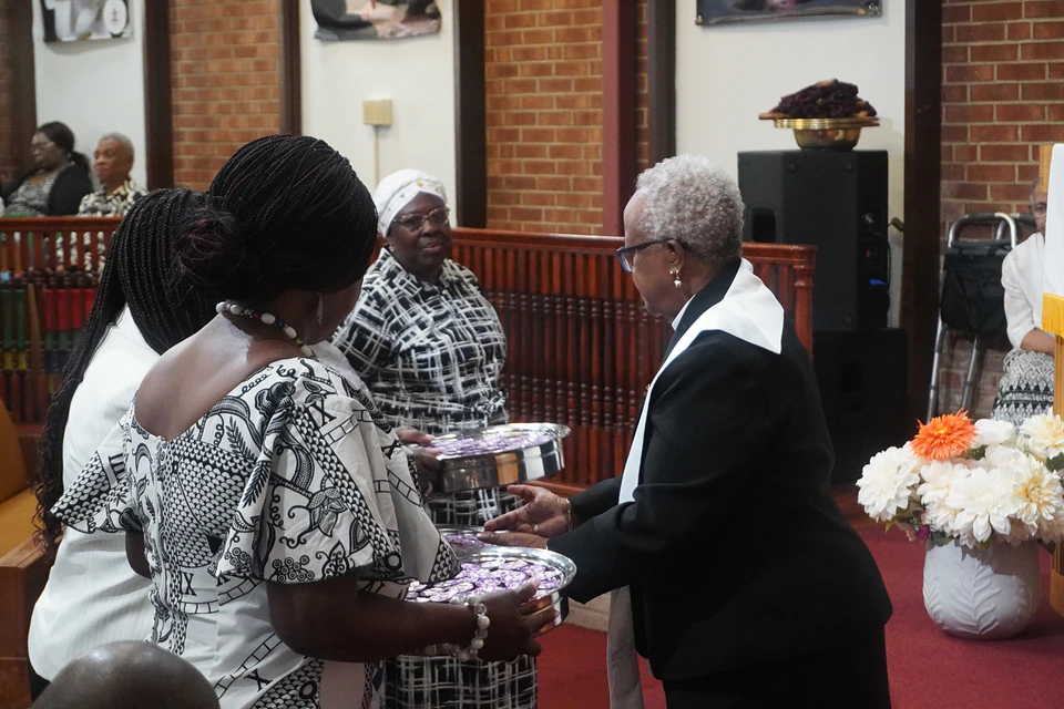 Members sharing communion at First Presbyterian Church of Irvington
