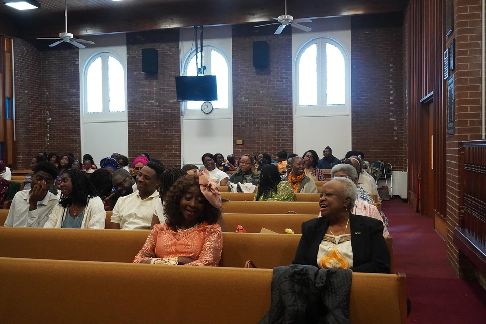 Families and members seated together in the sanctuary