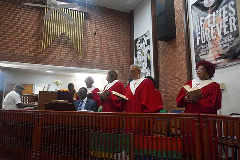 The choir and musicians together beside the organ